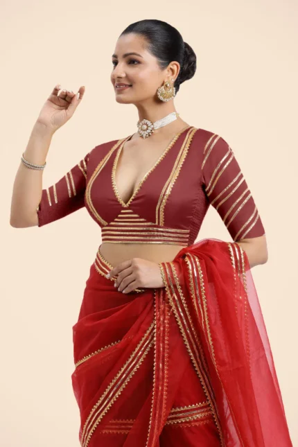 Navya x Tyohaar | Auburn Red Elbow Sleeves FlexiFit Saree Blouse with Plunging V Neckline with Tasteful Golden Gota Lace