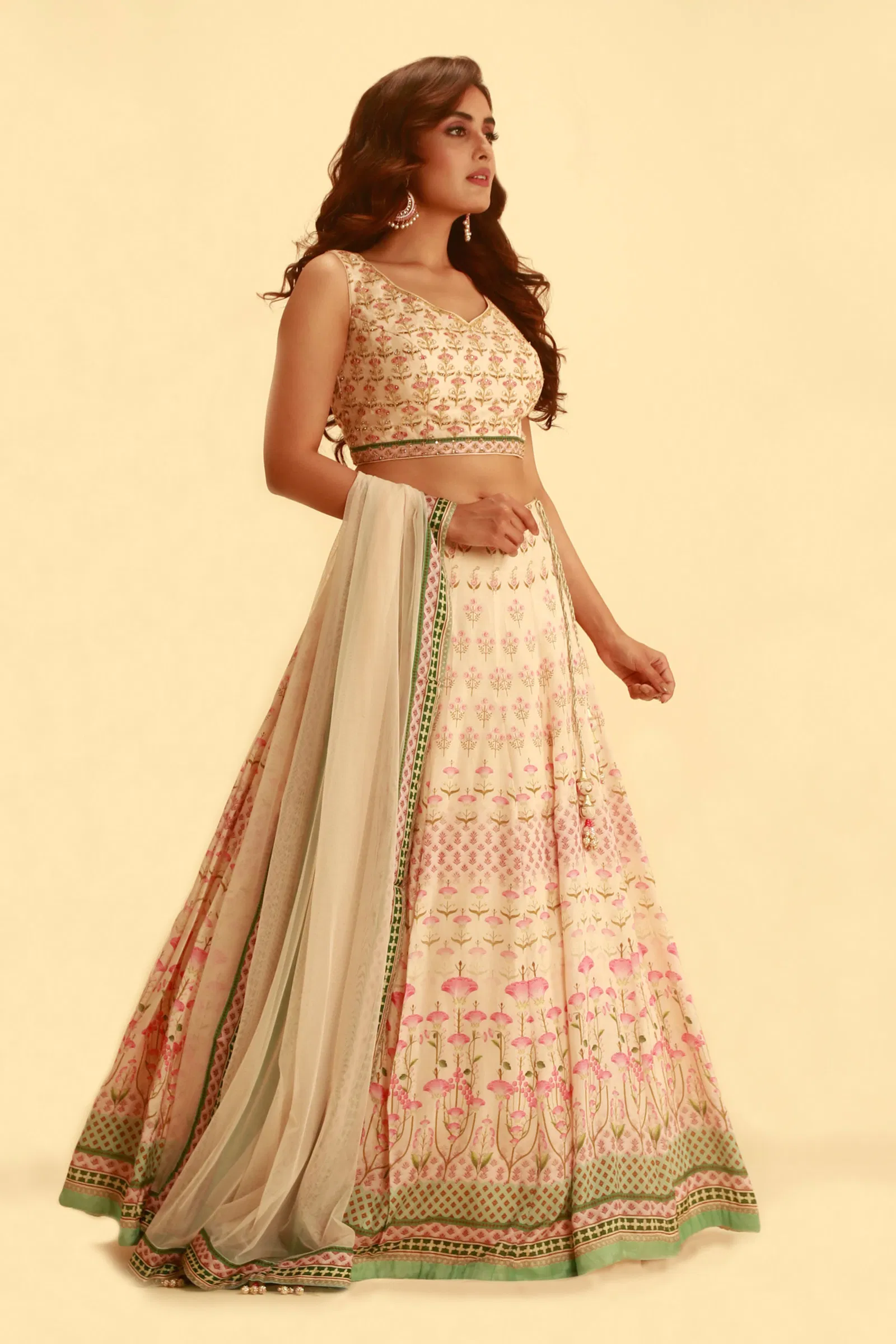 pink printed lehenga set with contrast fern green colour and matching tulle dupatta